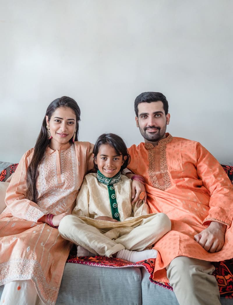 Parents with their child at home